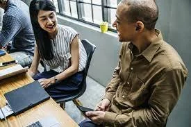 Co-workers engaging in discussion